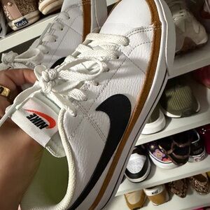 Nike Women's White and Black Sneakers with Orange Accents